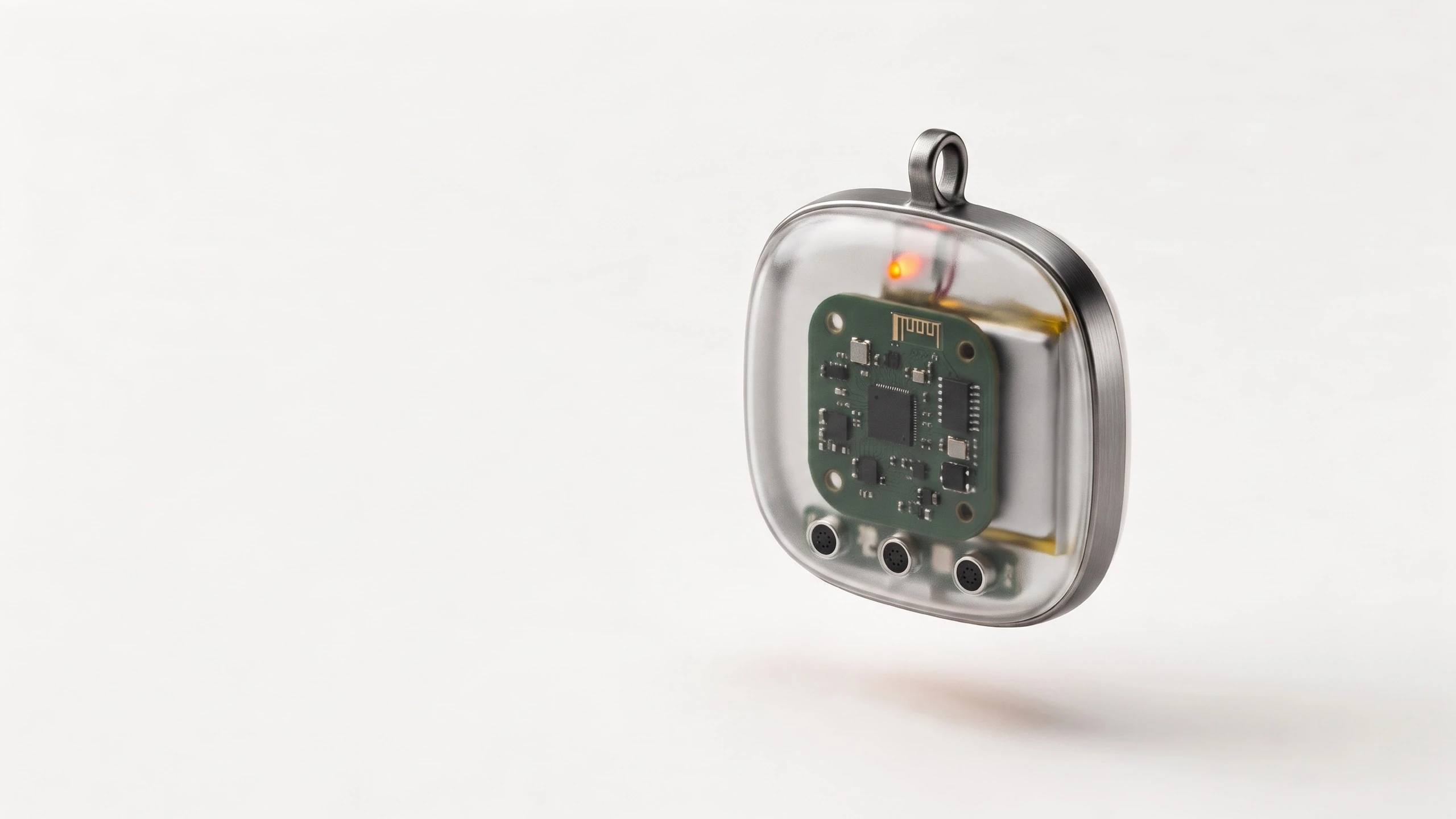 Concept render of the pendant with a clear shell, showing its circuit board, battery and three microphones