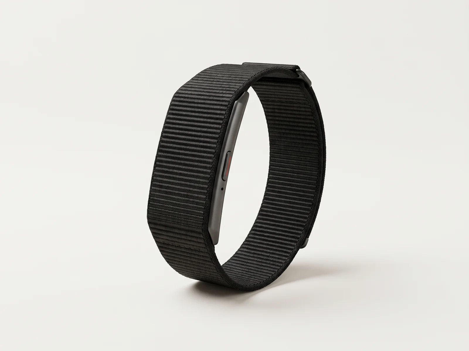 Product render of the slim screenless health band: a black woven loop strap with a thin graphite module and one button